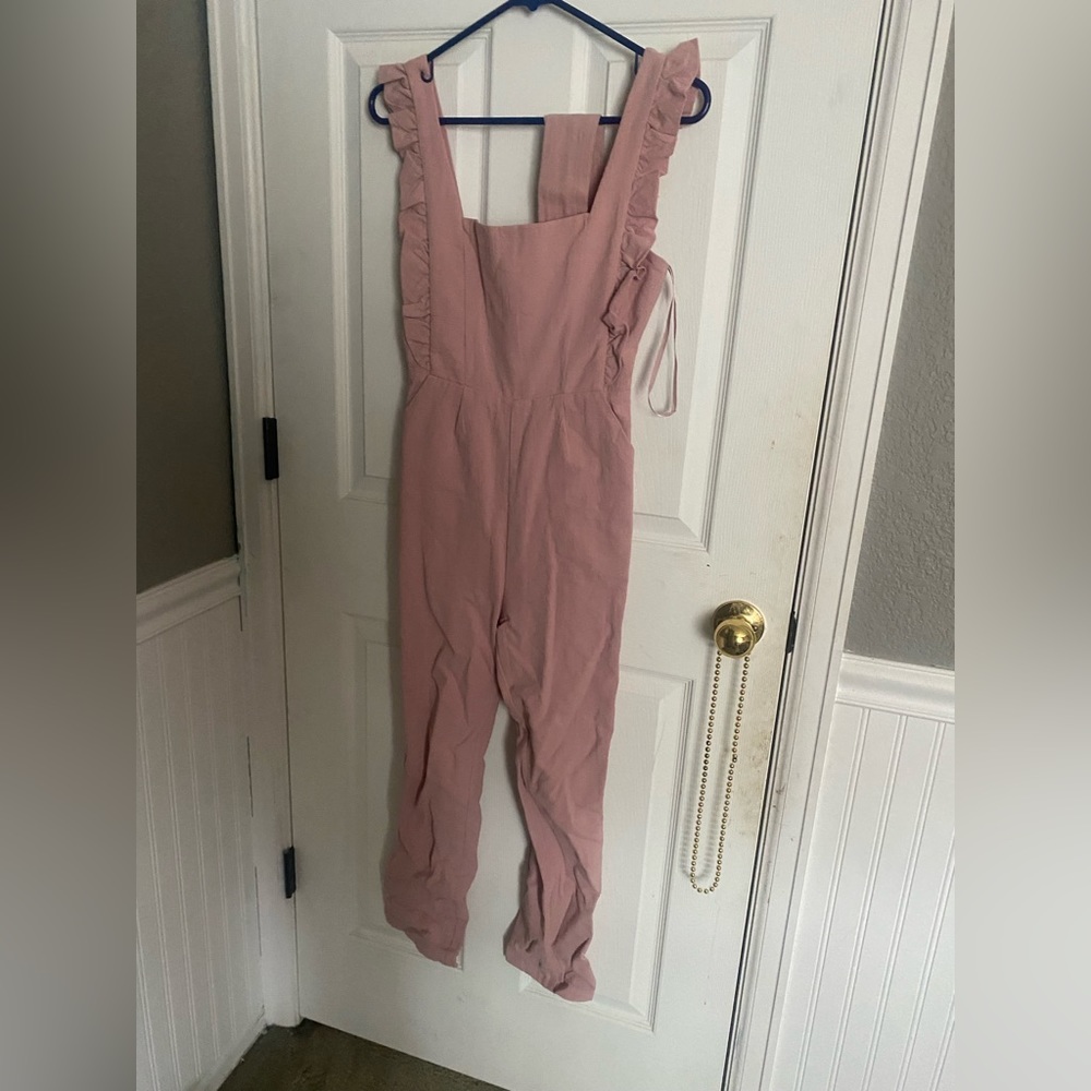 This is a jumpsuit from hello molly and it a kind of mauve color.